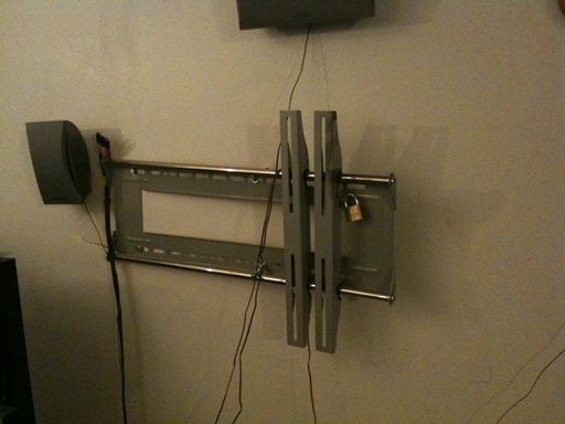 TV pried off the wall to defeat the padlock I had on it
